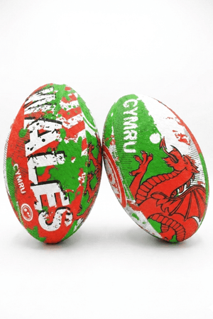 Two green, red and white Optimum Wales rugby balls with WALES CYMRU print and red dragon on white - Optimum